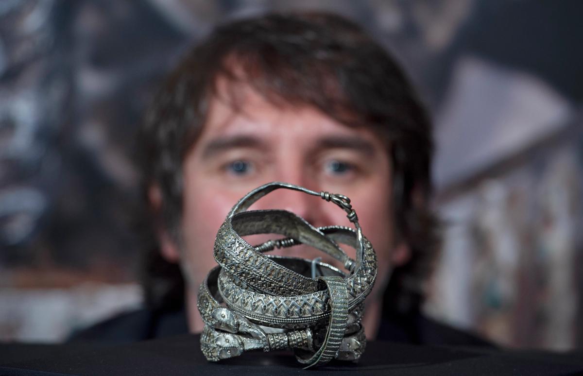 Curator Martin Goldberg with one of the Viking-era discoveries Photo: Neil Hanna