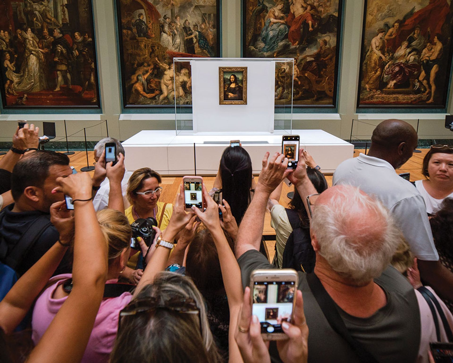 Snap scrap: visitors besieging the Mona Lisa, which was moved from its usual gallery in July Photo: Mika Baumeister