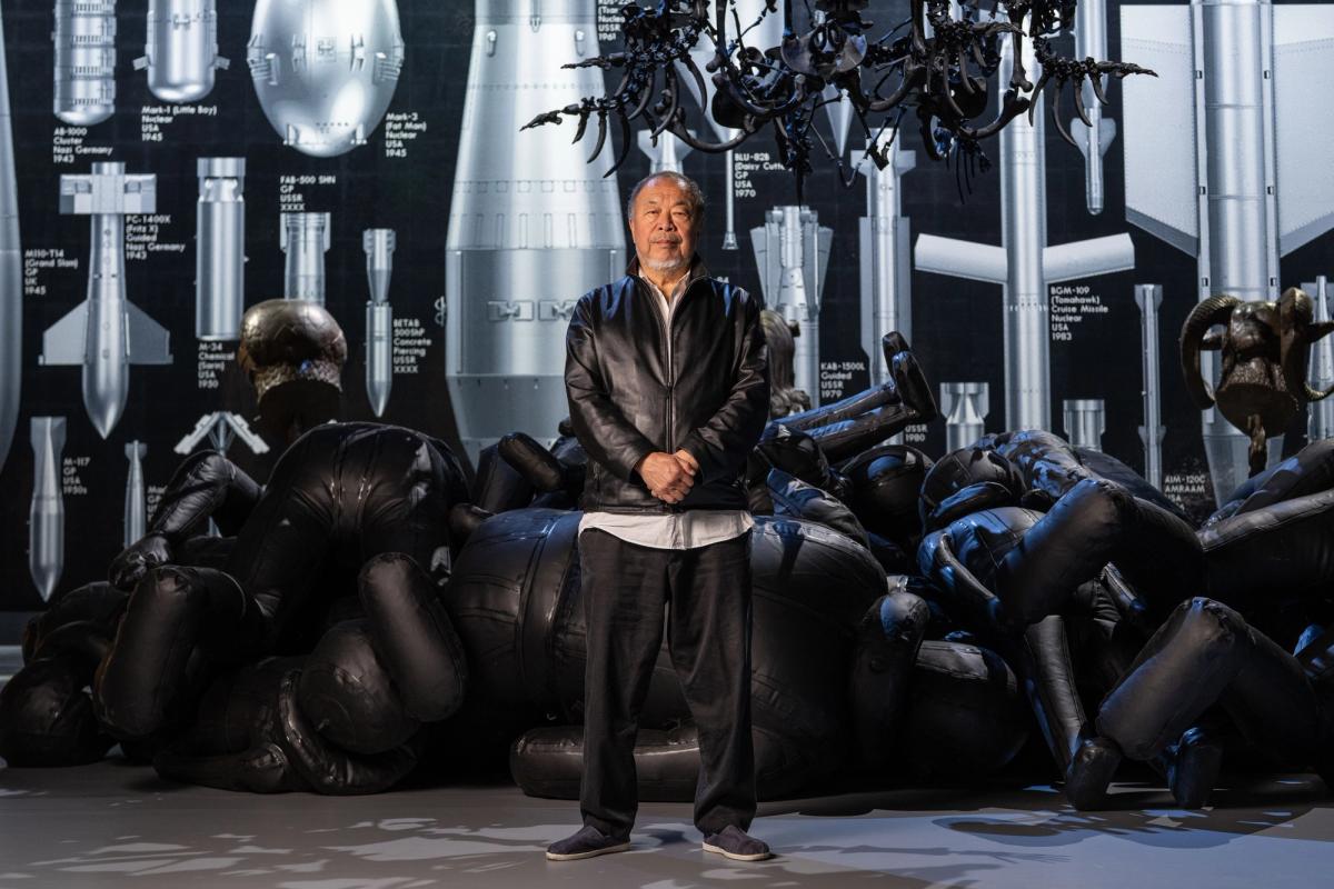 The artist in front of the new, large-scale commission History of Bombs

Photo: Hugo Glendinning