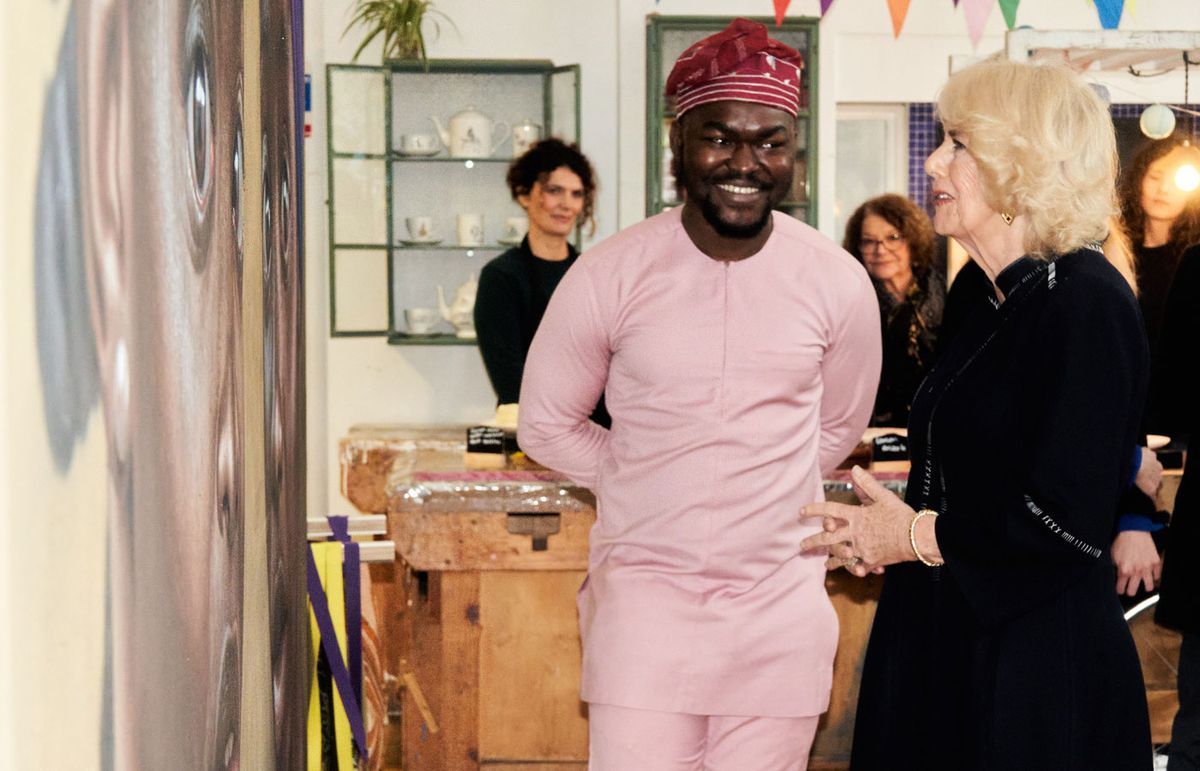 Queen Camilla with the artist Babajide Olatunji and one of his photorealistic portraits at Kindred Studios, west London, this week Lily Bertrand Webb