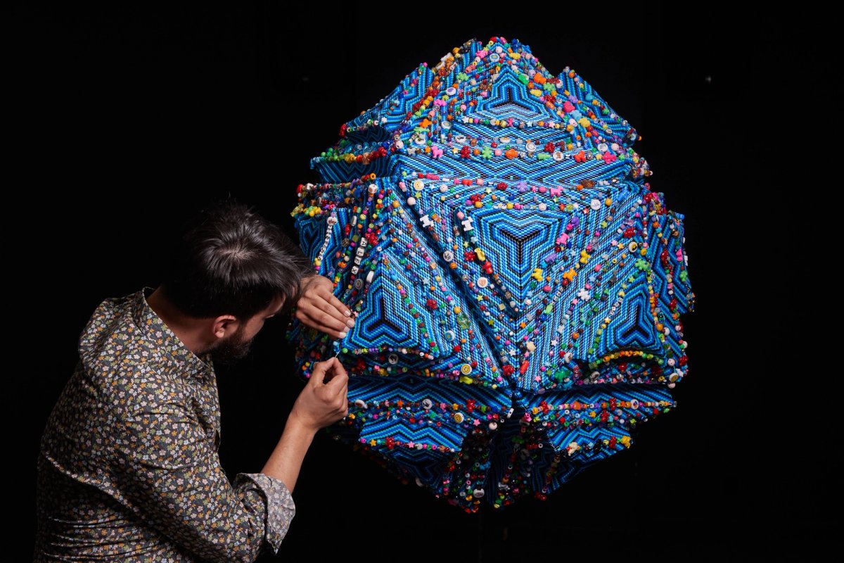 Nico Williams working on his Monument to the Brave, made from 250,000 multi-coloured beads, to be installed in a Toronto Sick Kids hospital opening in 2023