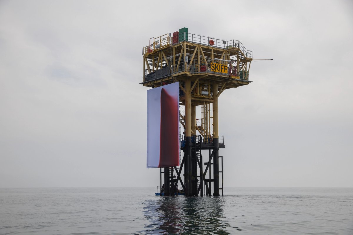 The 12m by 8m canvas was covered in 1000 litres of blood-red liquid, symbolising the wounds inflicted on the world by oil and gas companies
© Andrew McConnell / Greenpeace