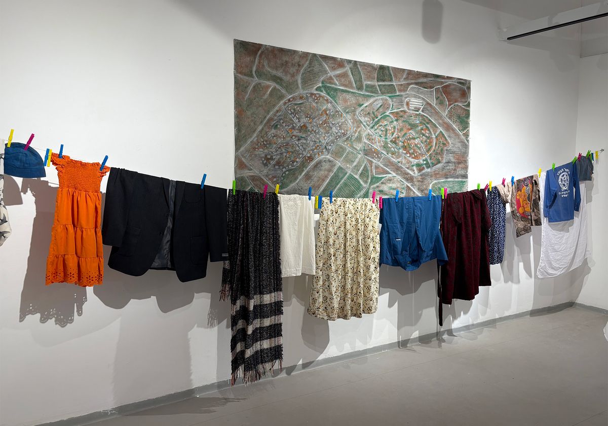 Abed Elsalam Sabia', Shared Clothesline (2025). Clothes gathered from residents of Metzer and Meiser Photo © Karen Chernick