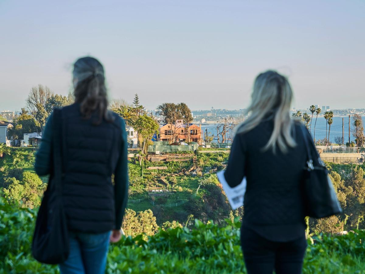 Visitors at the site in the Palisades for the planned memorial Photo: J. Abreu