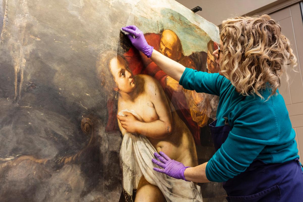 Conservator Adelaide Izat working on Susanna and the Elders

Royal Collection Trust / © His Majesty King Charles III 2023

