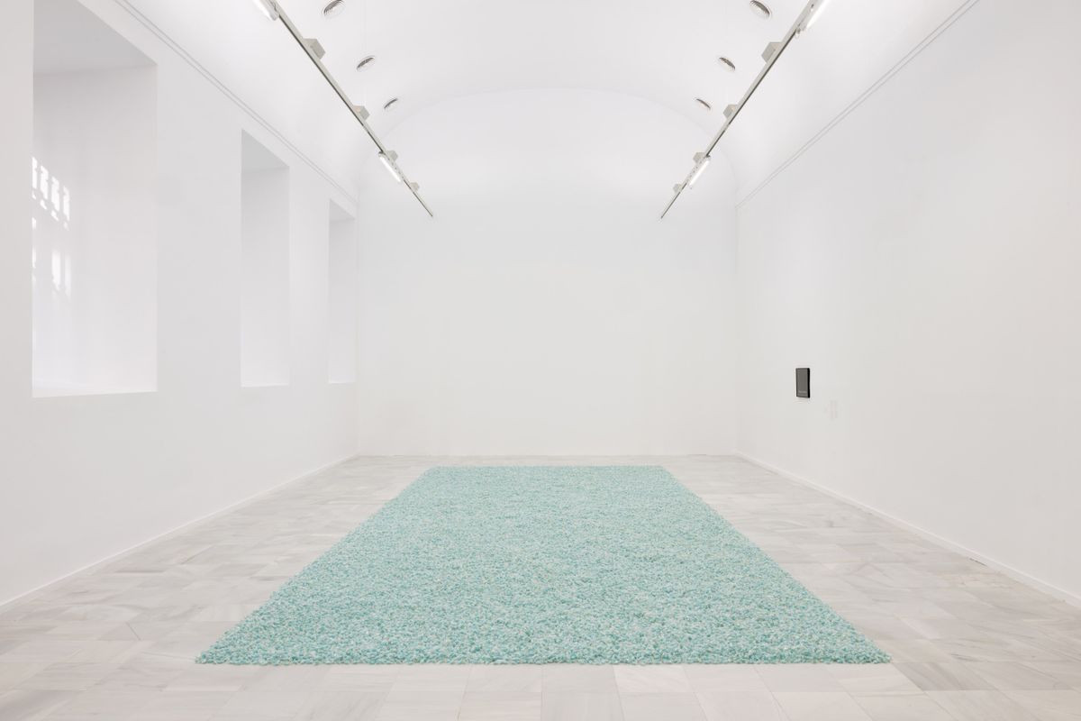 For the Reina Sofia exhibition Sweet Revenge, Gonzalez-Torres’s installation of hundreds of pounds of candies is laid out like a carpet Photo: Roberto Ruiz. Church: © Dirk Rose