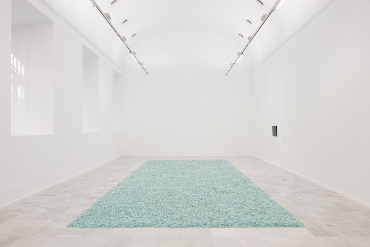 For the Reina Sofia exhibition Sweet Revenge, Gonzalez-Torres’s installation of hundreds of pounds of candies is laid out like a carpet Photo: Roberto Ruiz. Church: © Dirk Rose