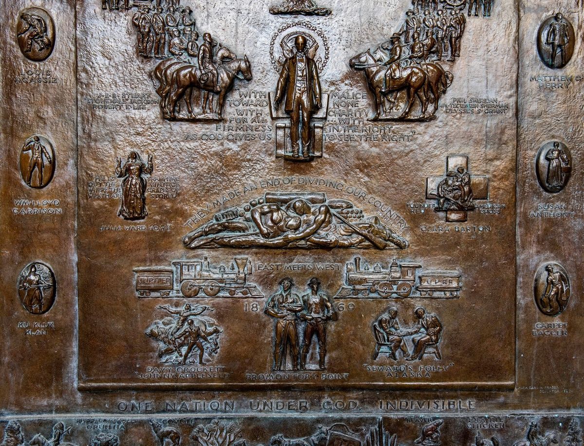 A detail of Laura Gardin Fraser's monumental triptych on the exterior of the Bartlett Hall Science Center at the US Military Academy in West Point, which includes, at lower left, an image of a Ku Klux Klan member Photo courtesy West Point, United States Military Academy, via Facebook