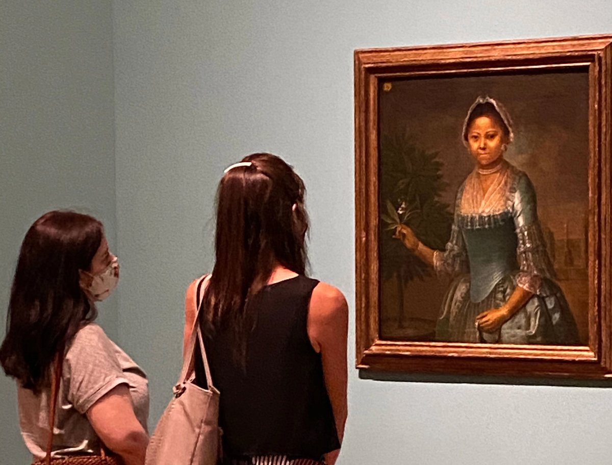 Visitors to the Art Gallery of Ontario wear masks as a health precaution