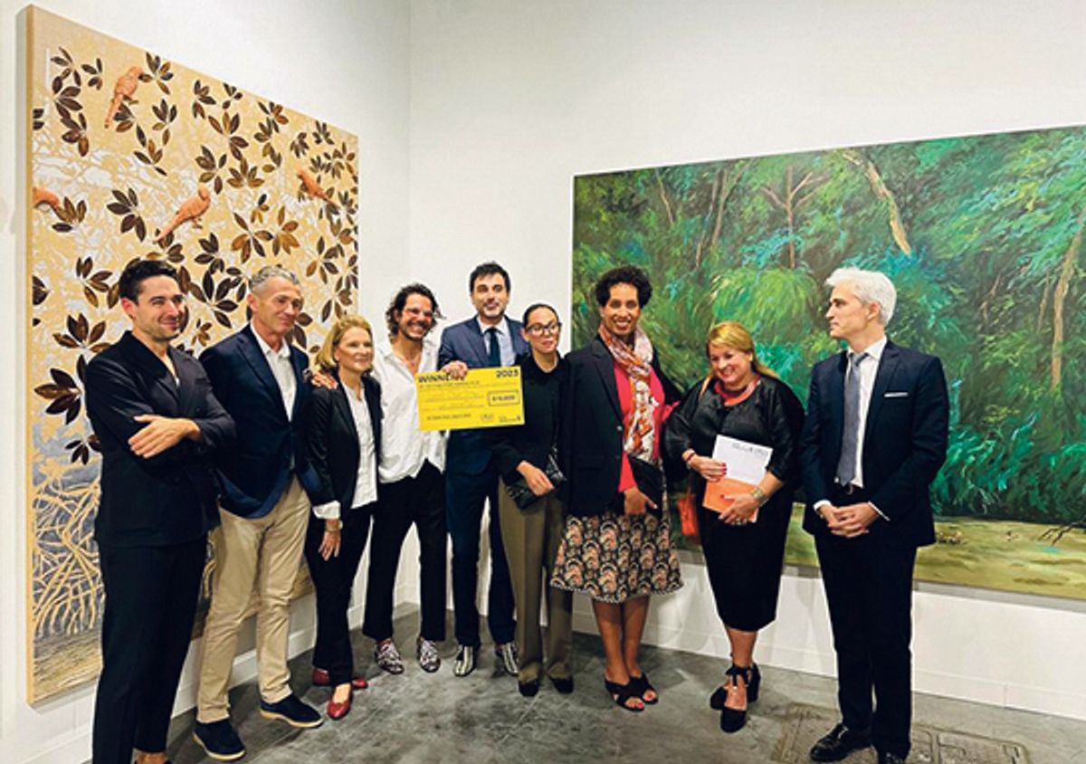 Mor Charpentier’s Alex Mor and Philippe Charpentier (fourth and fifth from left) collect Otero Torres’s prize Courtesy French Professional Committee of Art Galleries (CPGA) and Villa Albertine