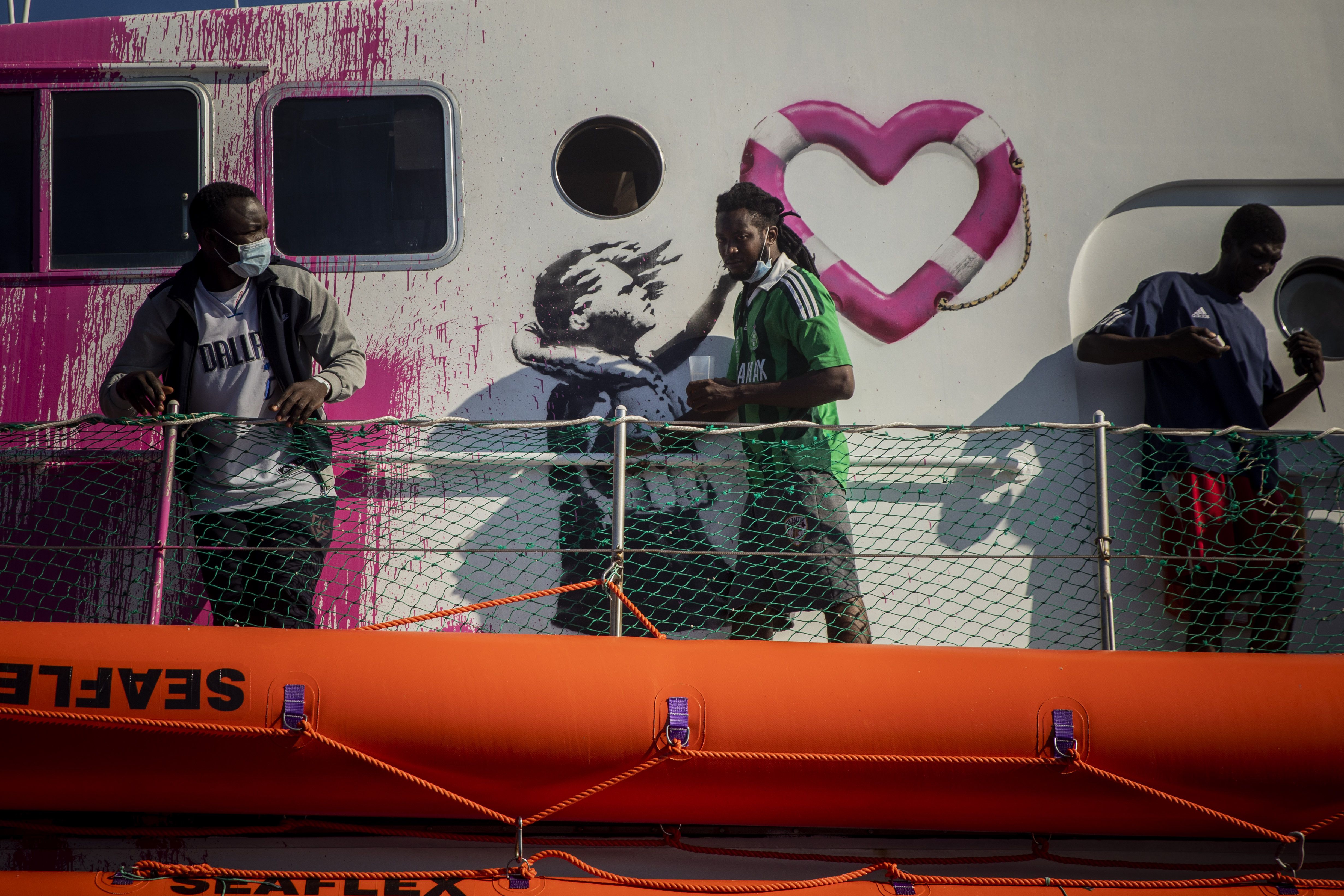 Hundreds of migrants removed from Banksy funded rescue boat amid