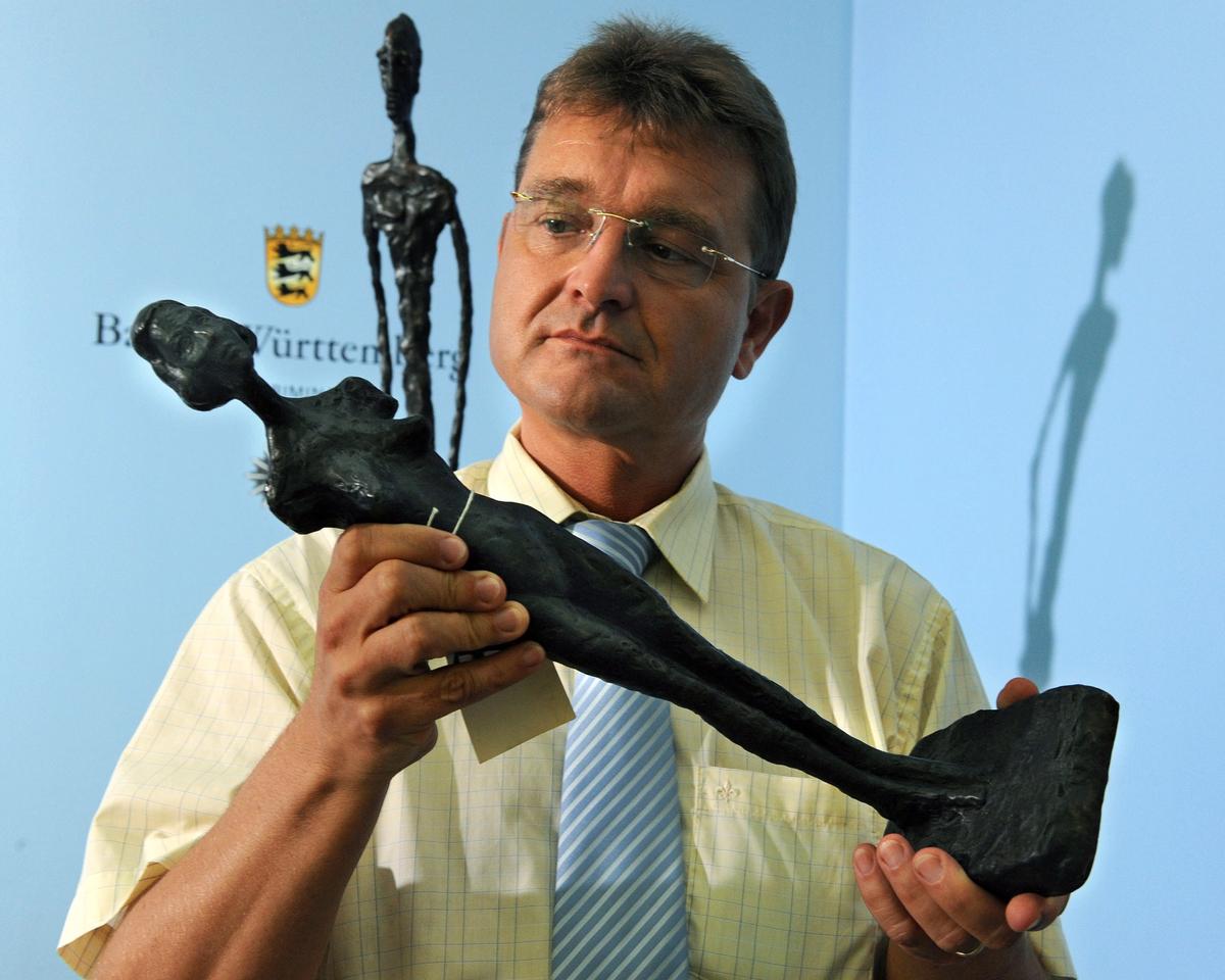 Horst Haug of Baden Wuertremberg's State Office of Criminal Investigation (lka) presents counterfeit sculptures purportedly by the Swiss artist Alberto Giacometti in Stuttgart, Germany, 19 August 2009 Photo: Norbert Foersterling/EPA/Shutterstock