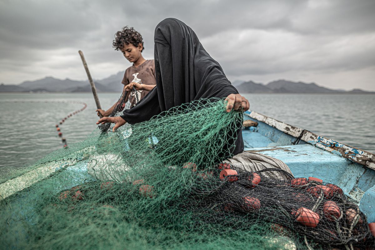 Portrait of veiled mother of nine fishing in Yemen wins World
