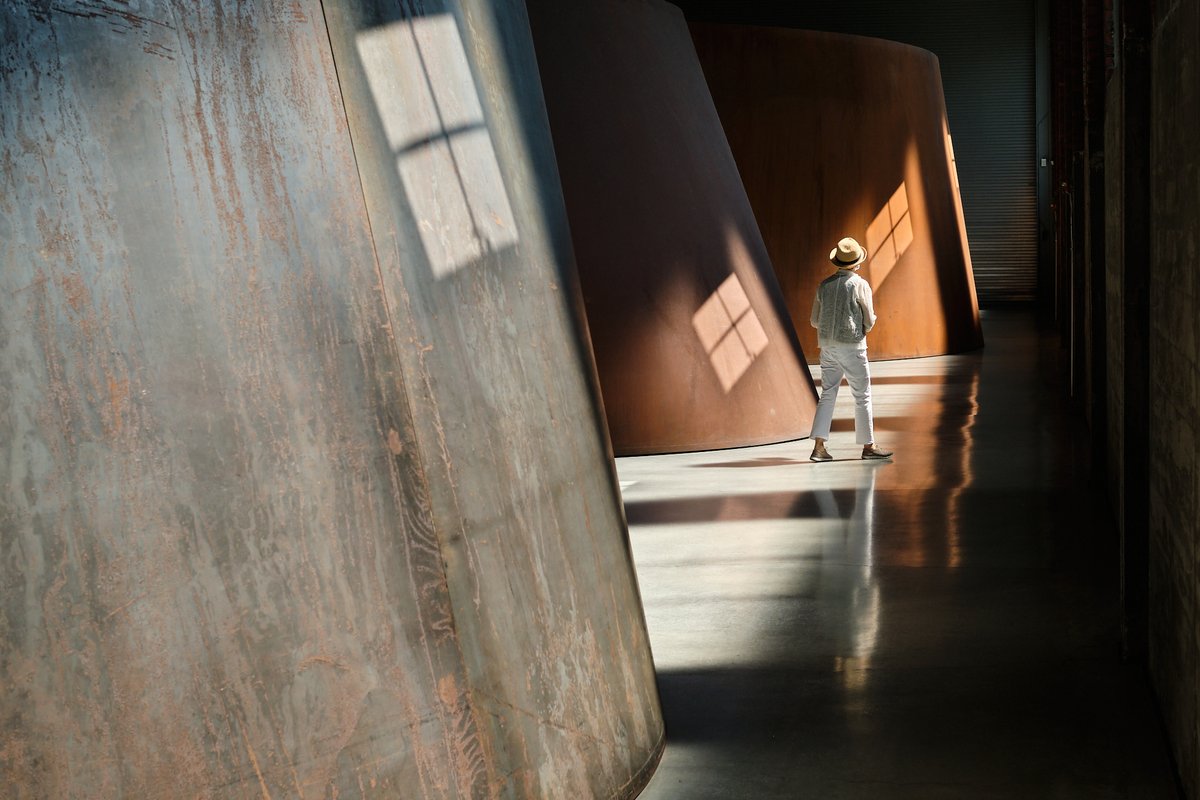 A visitor walks among Richard Serra's work at Dia Beacon, Beacon, New York
Photo: Don Stahl