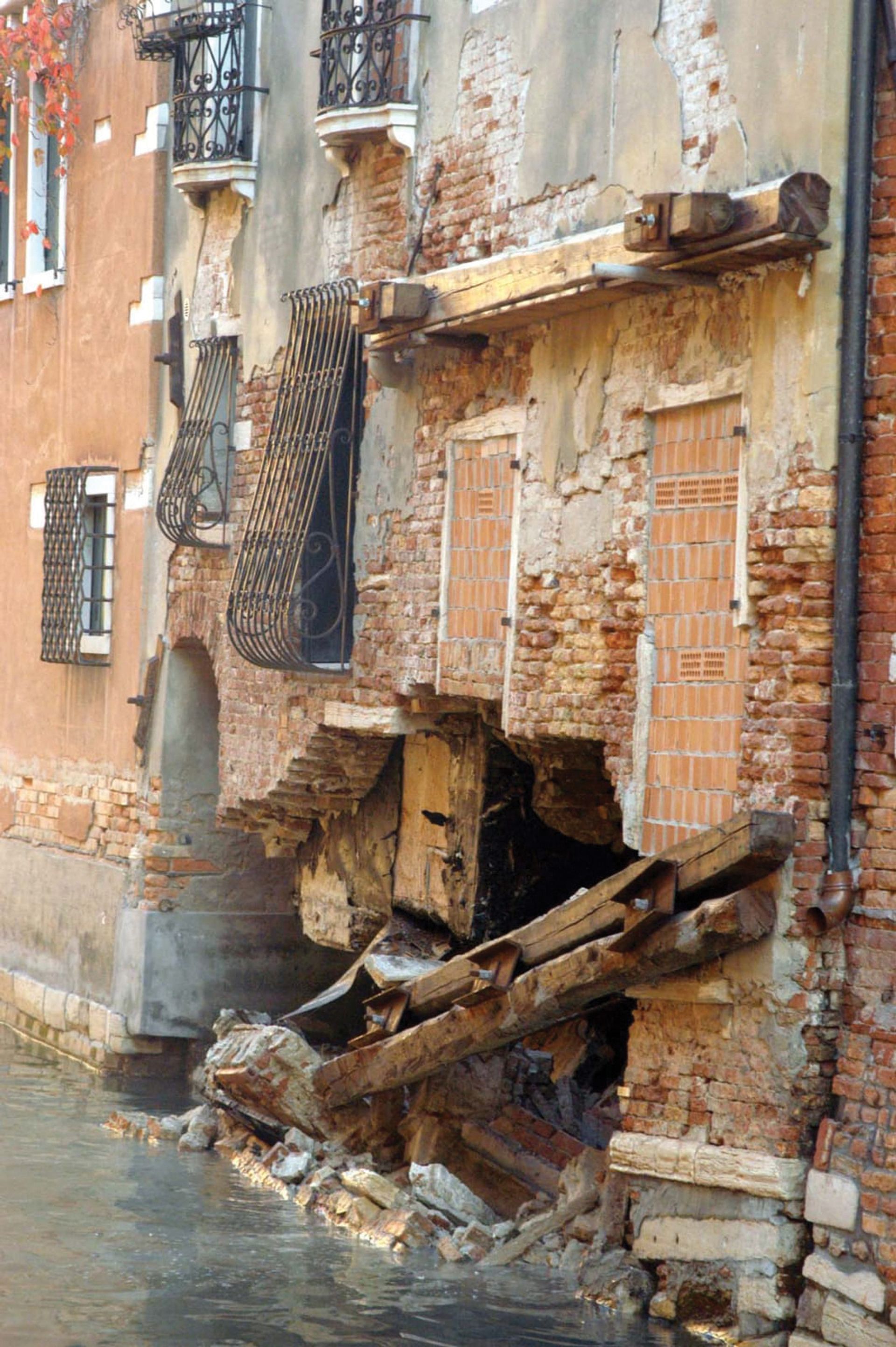 A collapsed brick wall of a house in Venice, a victim of rising damp and increased salinity in the water. Photo: © Marco Tagliapietra