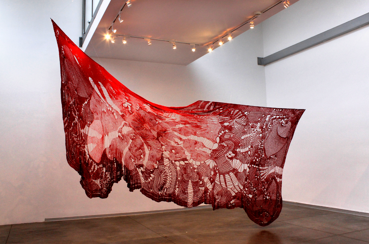 Cristina Flores Pescorán's Catarsis (2014-16). Textile work made with red threads of different sizes crocheted
Photo: Courtesy of the artist