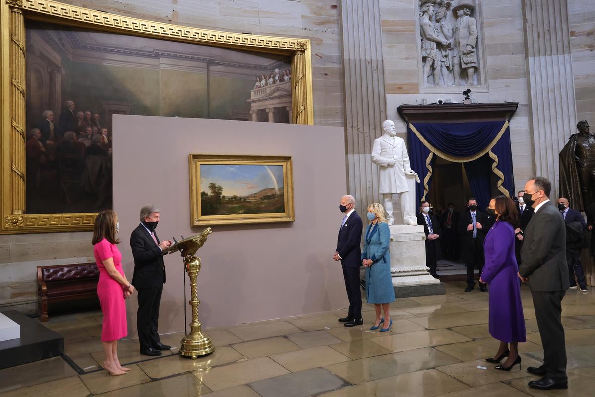 Senator Roy Blunt presents a painting to President Joe Biden and first lady Jill Biden, as Vice President Kamala Harris and Doug Emhoff look on at the presentation of gifts ceremony after the 59th Presidential Inauguration at the US Capitol on Wednesday Photo: Win McNamee/Getty Images