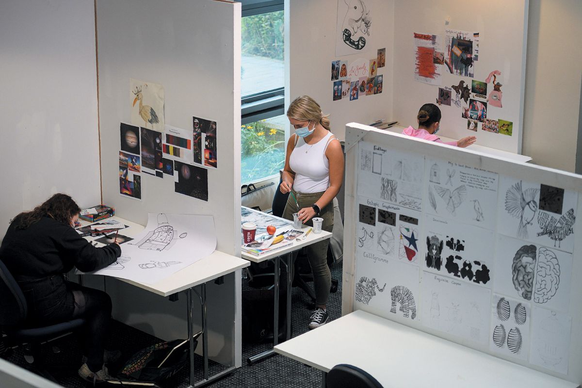 During the pandemic, students can work in studios only if they are separated by partitions and wearing face masks © OLI SCARFF/AFP via Getty Images