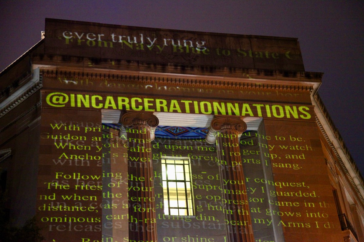 Words from inmates' letter cover the US Justice Department Building in DC. Courtesy of Incarceration Nations Network