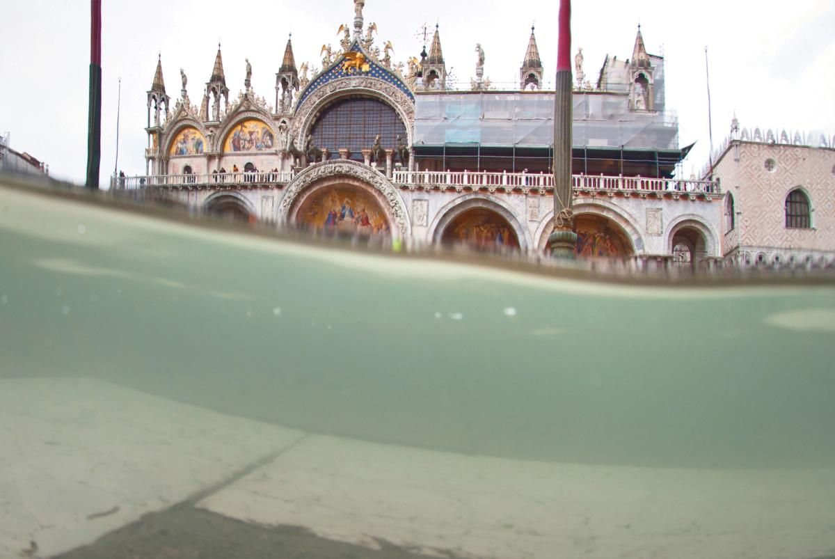 Flooding in St Mark’s Square, Venice. The procuratori of the basilica there last year built glass barriers in front of the Byzantine building to protect it Antonio Busiello