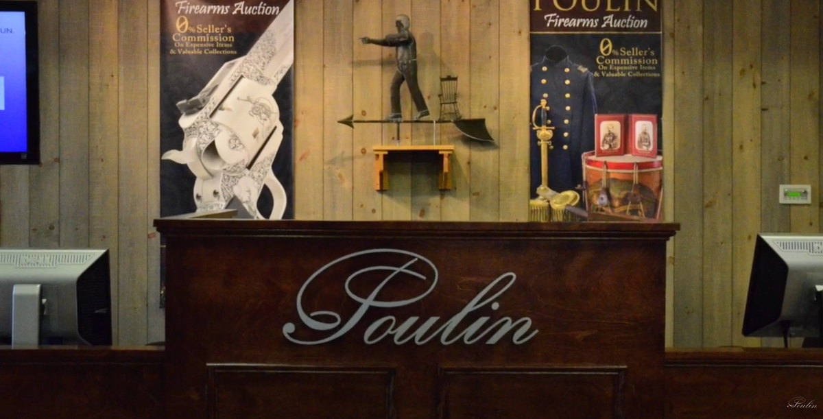 The podium of Poulin Antiques and Auctions in Fairfield, Maine, shown in a promotional video for a sale of antique firearms. Poulin Auctions.