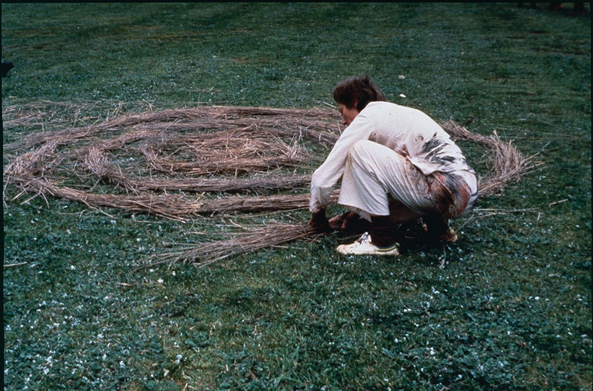 Artist Bonita Ely sculpts a woven form, redolent of a traditional aboriginal mat, in her video Jabiluka UO2 (1979)
Courtesy of the artist


