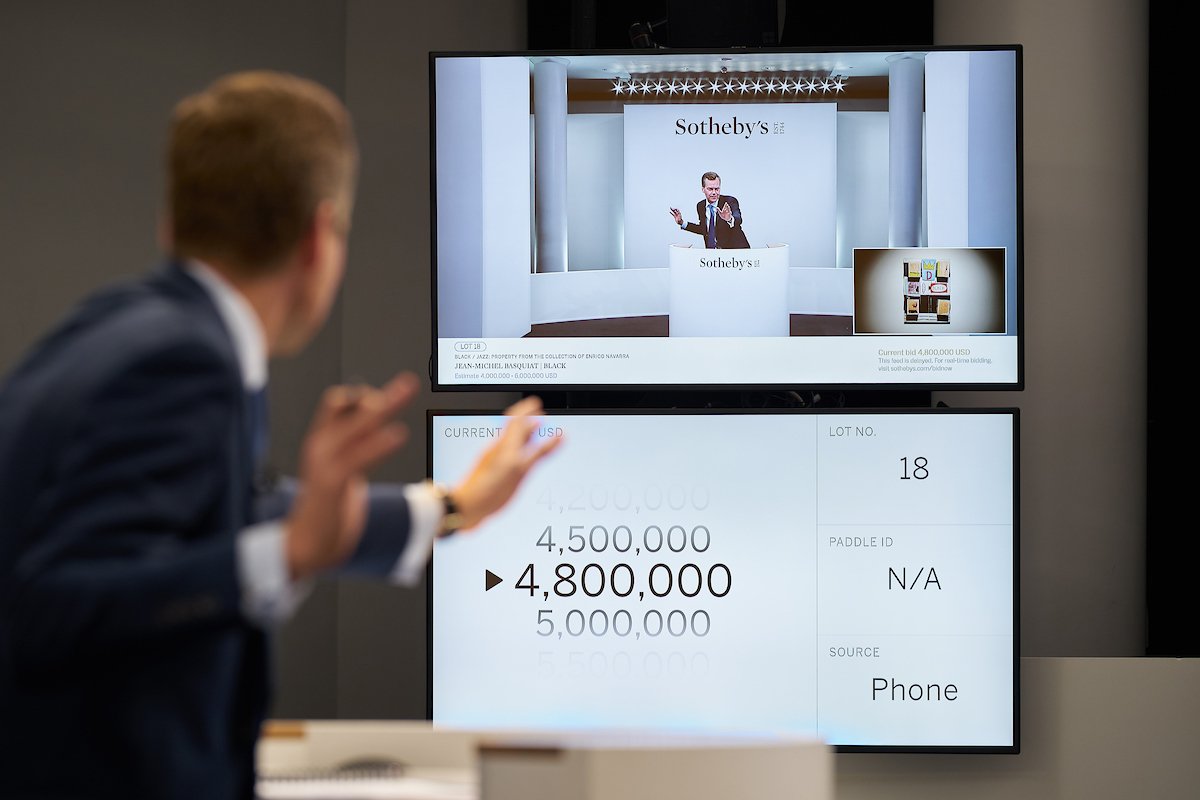 Auctioneer Oliver Barker selling Jean-Michel Basquiat's Black (1986) at the Sotheby's Contemporary Art Evening Auction in New York on 28 October Photo: Michael Bowles/Getty