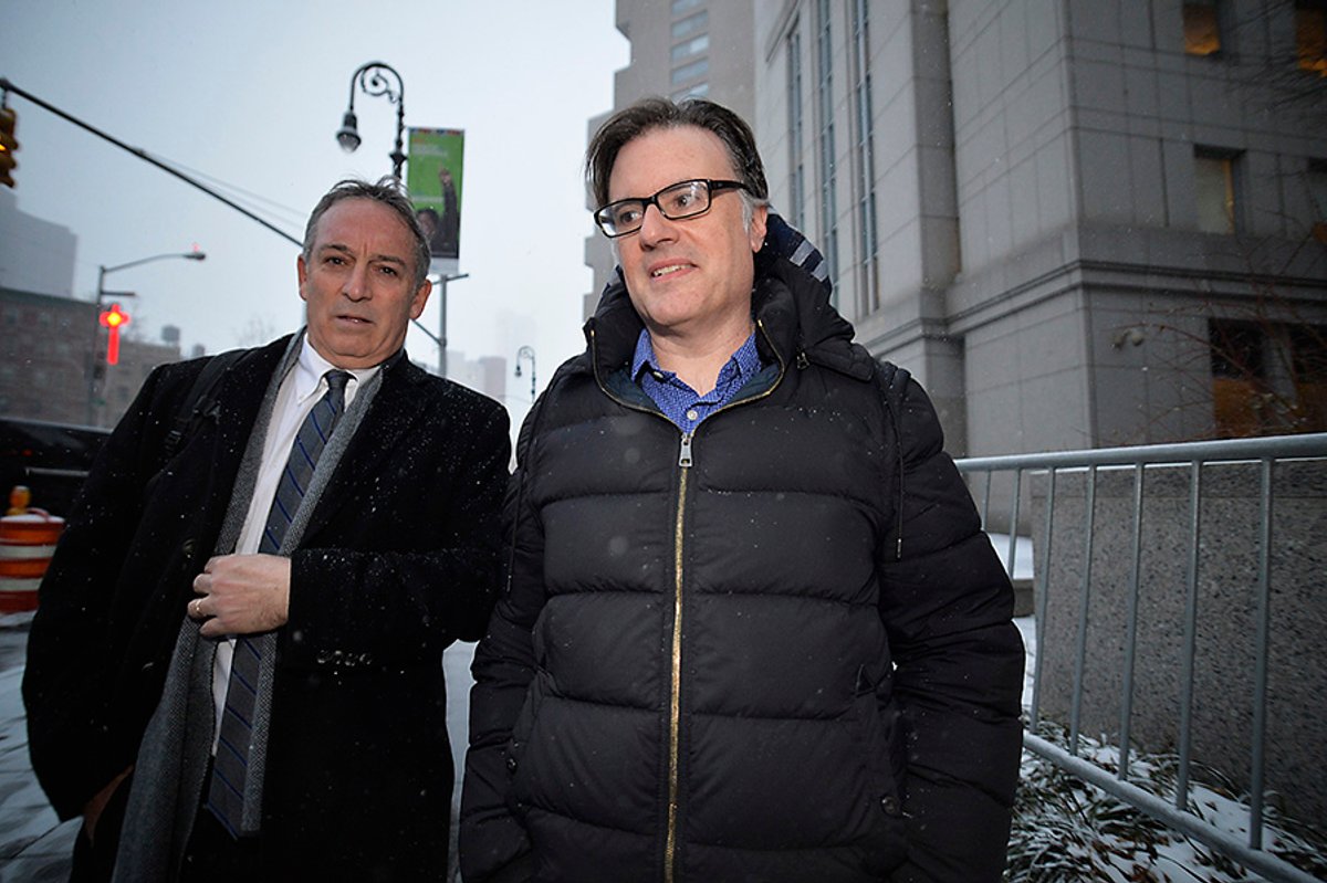 Former art dealer Ezra Chowaiki leaves Federal Court with his lawyer after his arraignment Matthew McDermott/Polaris