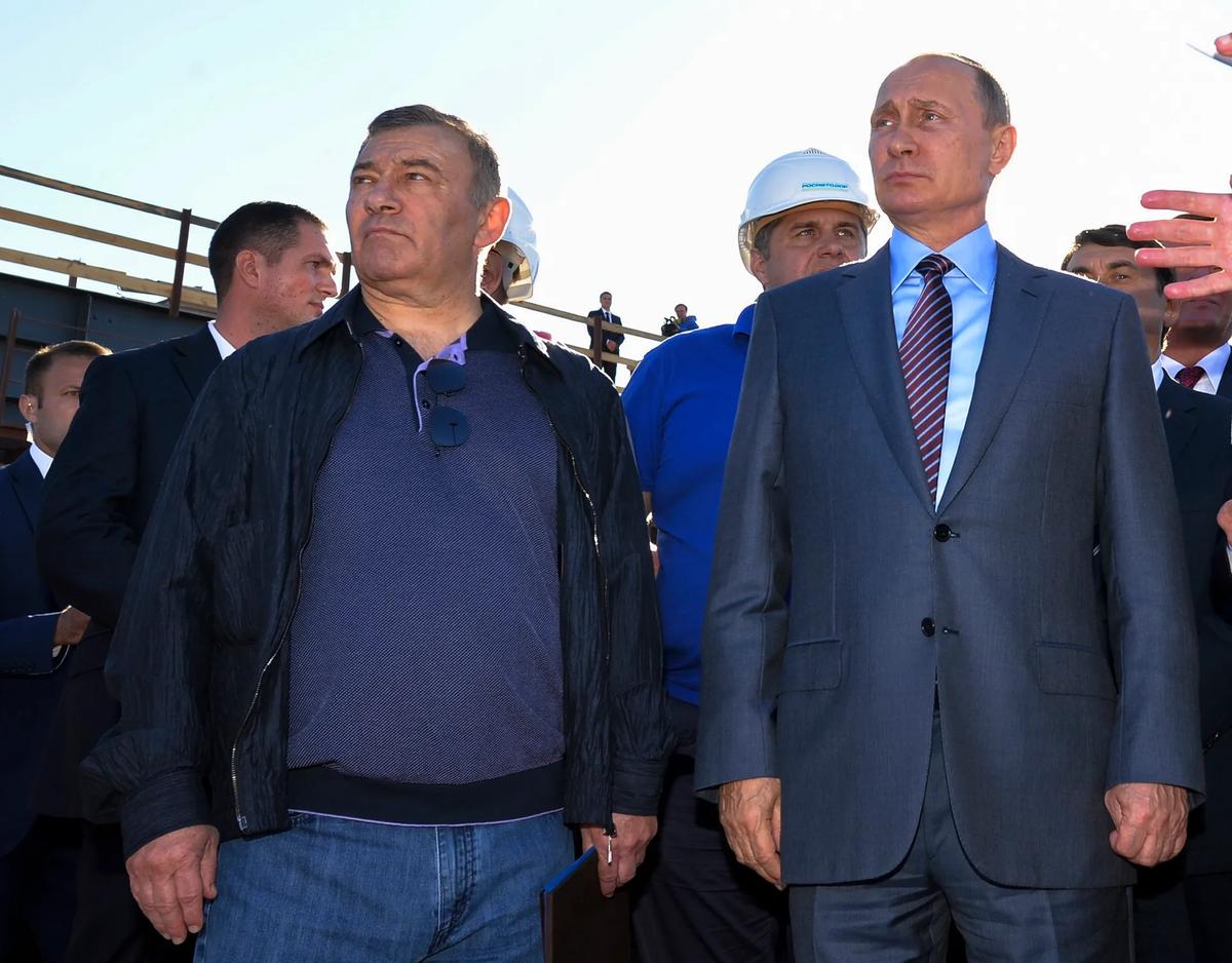 Billionaire Arkady Rotenberg (left) Russian President Vladimir Putin both face sanctions over the invasion of Ukraine © Alexei Druzhinin/Sputnik, Kremlin, File Pool Photo via AP