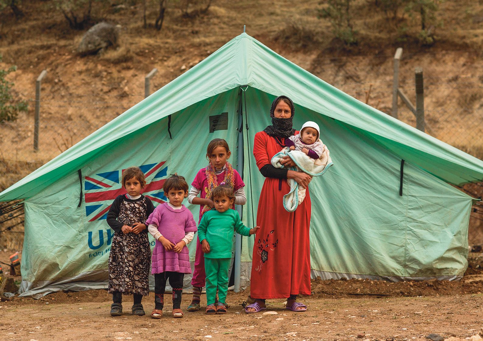 A Yazidi woman from Sinjar with children at a refugee camp in Lalish. Many Yazidis languish in refugee camps years after the Isis genocide, victims of political infighting between political factions in Iraq Eric Lafforgue/Alamy Stock Photo