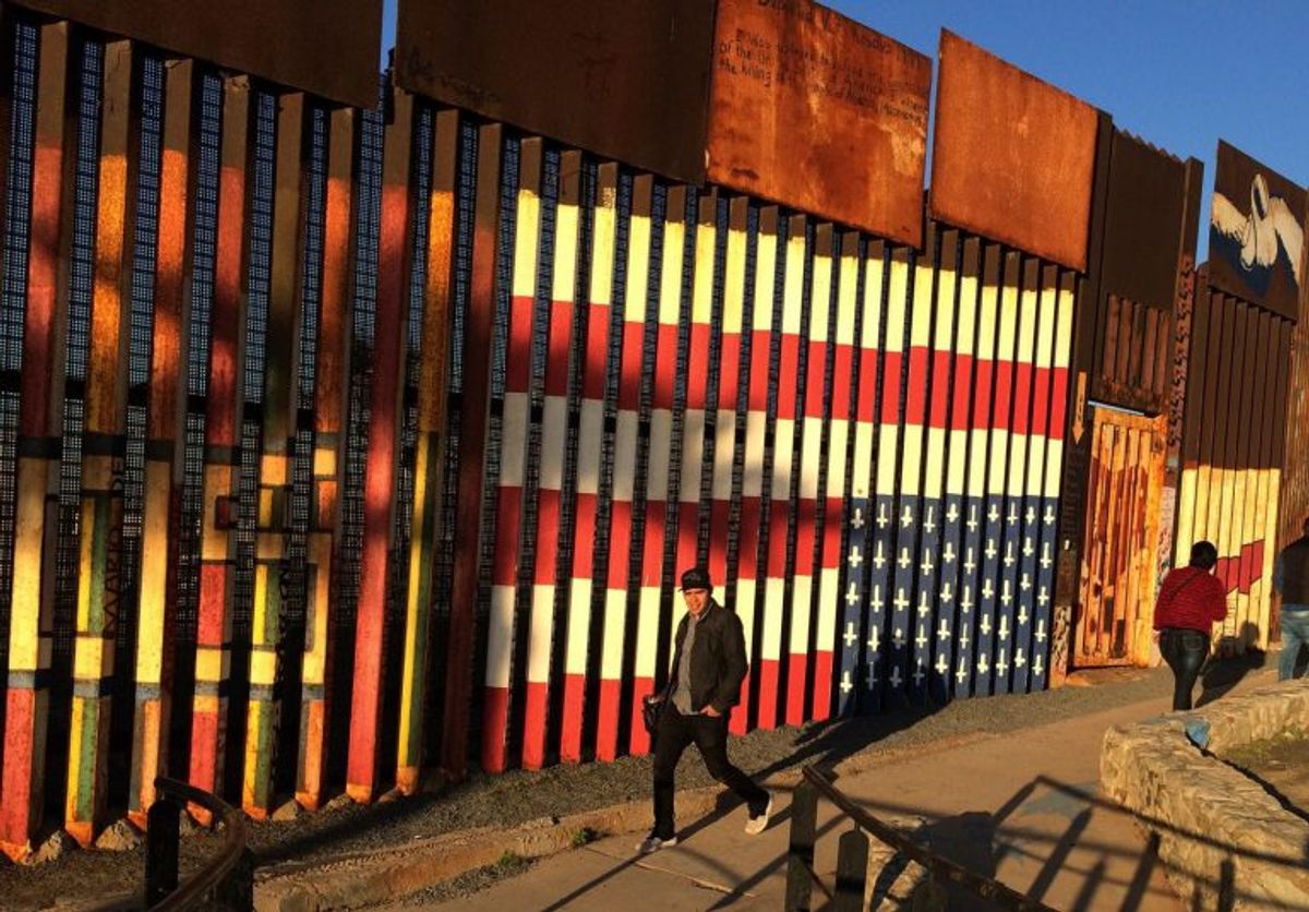 The upside-down flag mural painted by deported veterans on the Tijuana side of the US-Mexico border fence