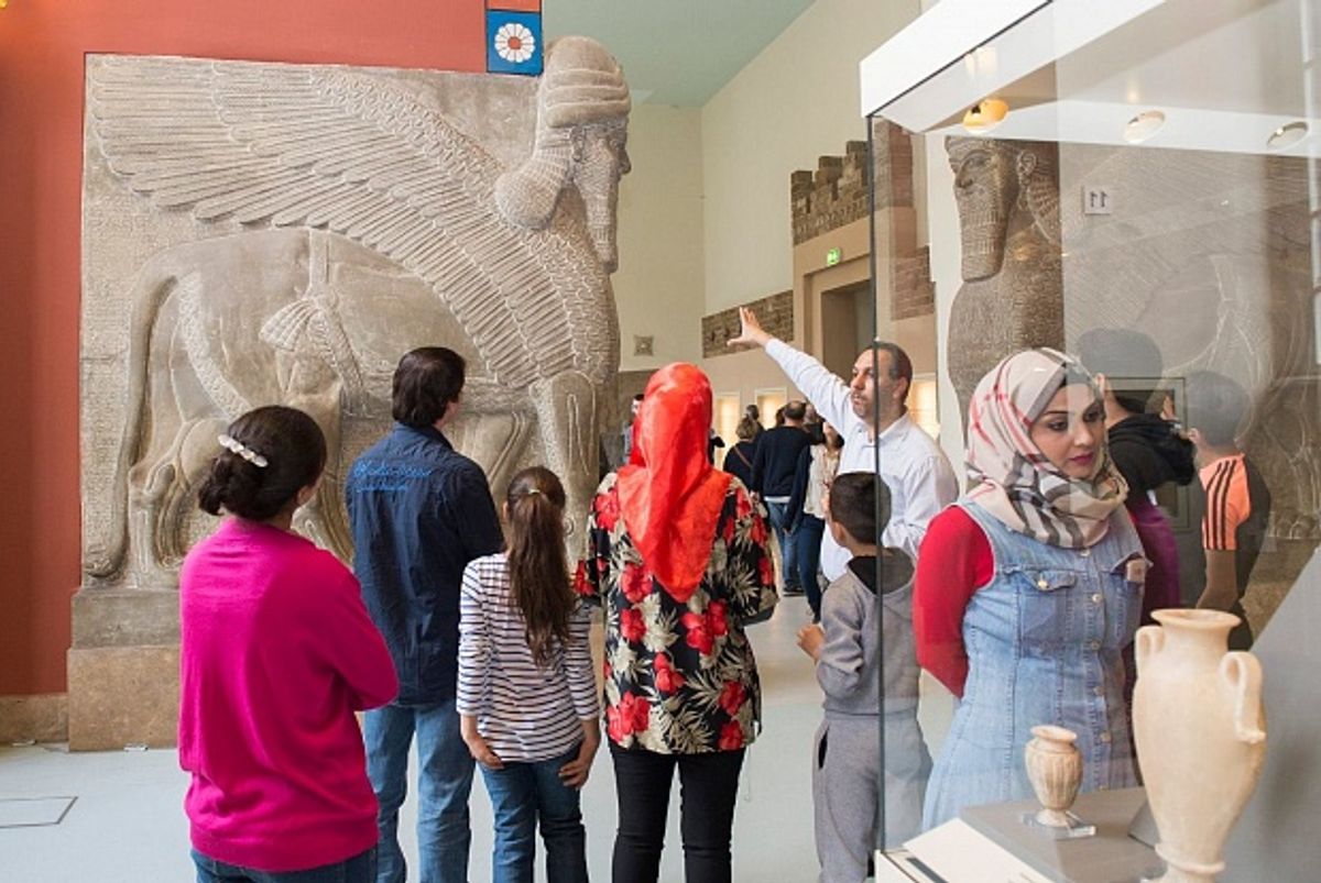 A Multaka guide takes a group on a tour of the Pergamon Museum Milena Schlösser