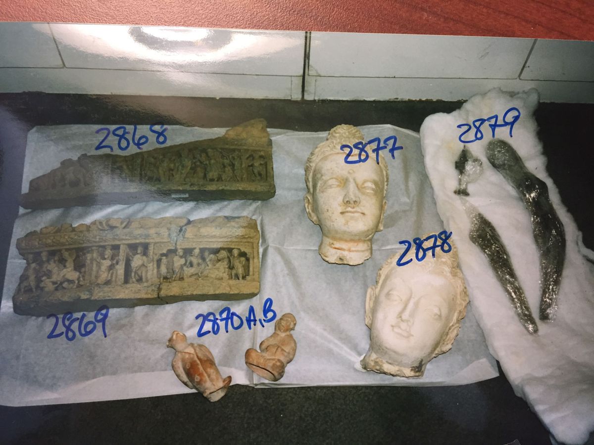 Among the objects seized by US authorities from storage facilities in New York were two stucco Gandharan Buddha heads that were excavated from Afghanistan after paying off a Mujahedeen commander who controlled the area 
