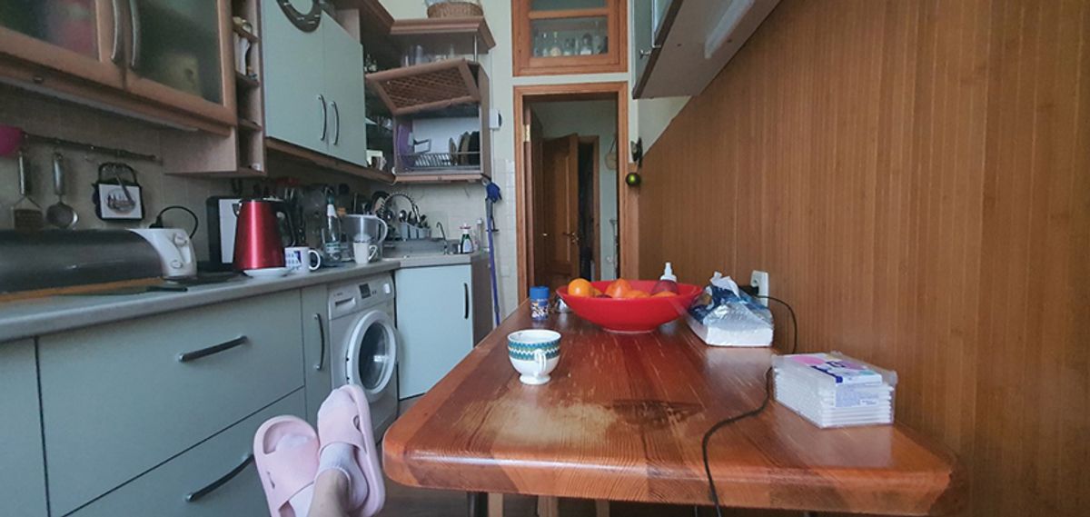 Hanna Sherman, the editor-in-chief of Antiquarian magazine, photographs her feet in cozy slippers against the backdrop of an ordinary Kyiv kitchen every morning Image: courtesy of Hanna Sherman