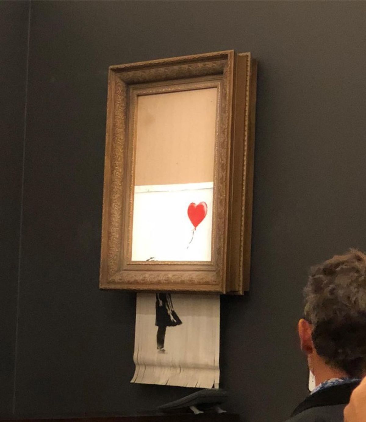 Banksy's Girl With Balloon (2006) mysteriously self-destructed at the end of a Sotheby's auction Casterline Goodman Gallery