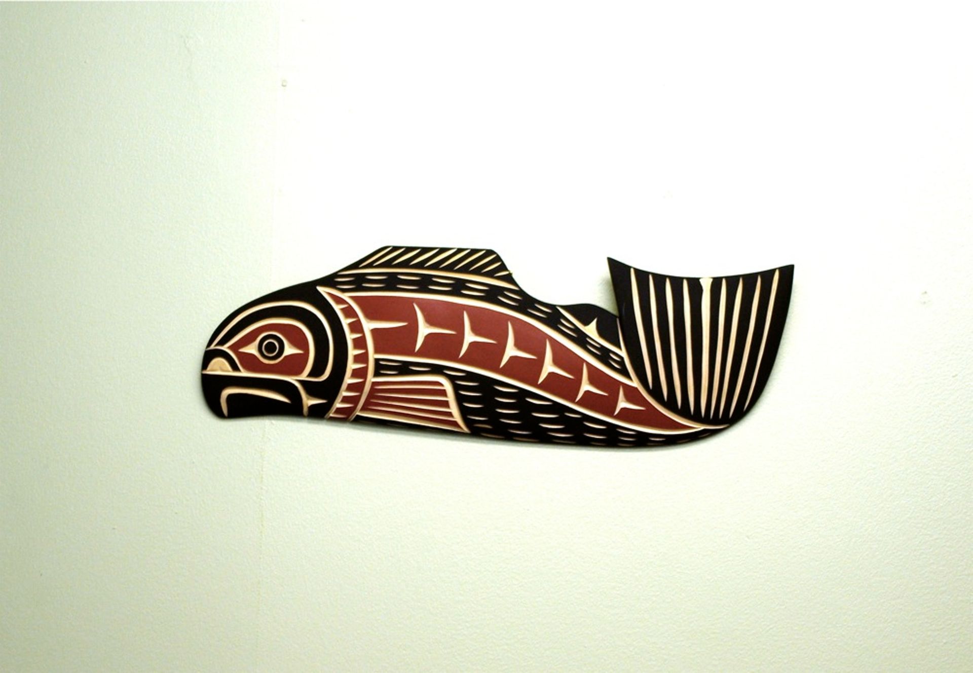 A cedar wood carving of a salmon by "Harvey John" Tribal Spirit Gallery