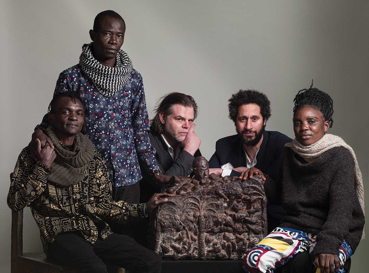 Members of the Congolese Plantation Workers Art League with the Dutch artist Renzo Martens (middle) and the curator of the Dutch Pavilion at this year’s Venice Biennale, Hicham Khalidi (second from right)

Photo © Koos Breukel, 2023