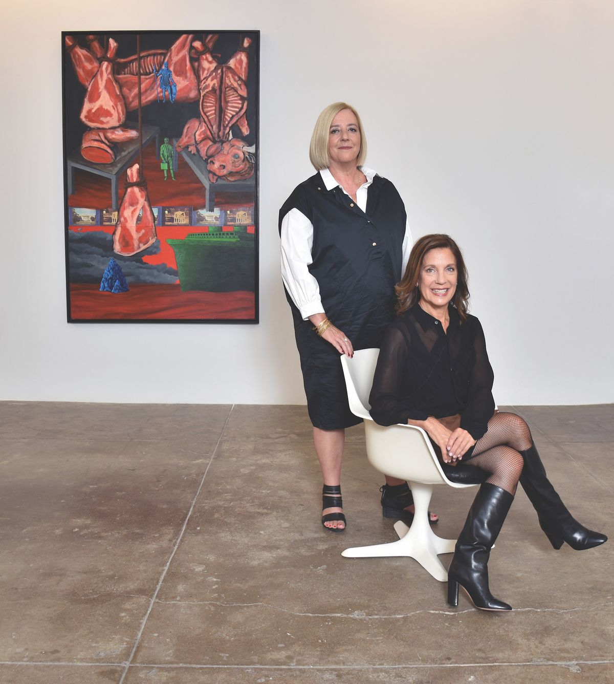 Portrait of Penny Pilkington and Wendy Olsoff (in background is artwork by David Wojnarowicz, North/South: The New Legionnaires, 1986) at 535 West 22nd Street, New York, 2017 Courtesy P•P•O•W, New York