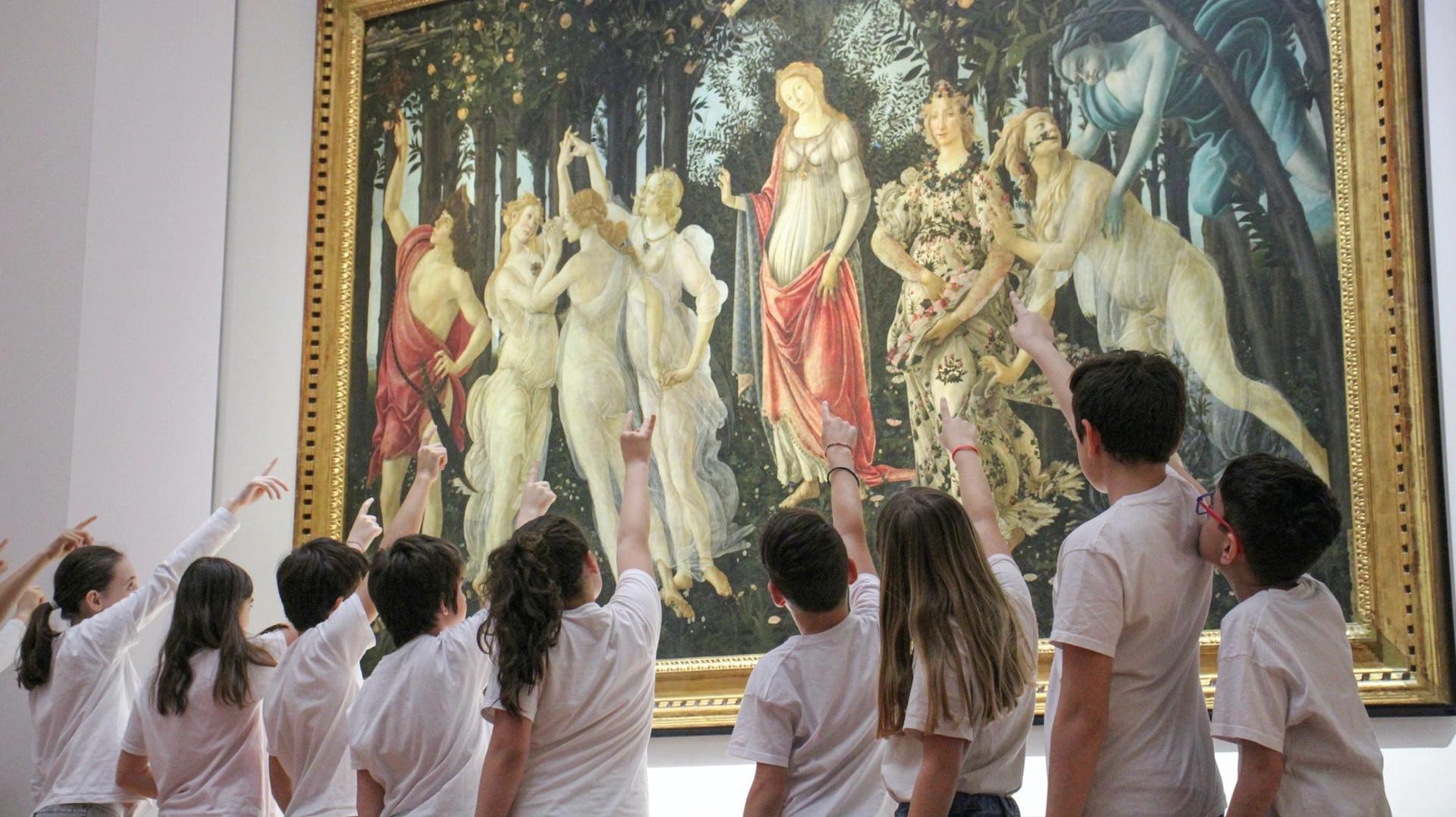 A group of children interact with Botticelli's masterpiece Primavera (around 1470s)
