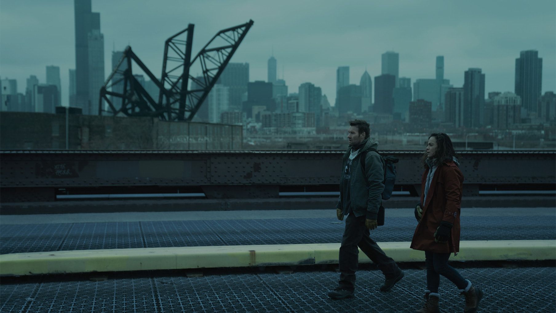 Jason and Amanda walking together in an unfamiliar universe