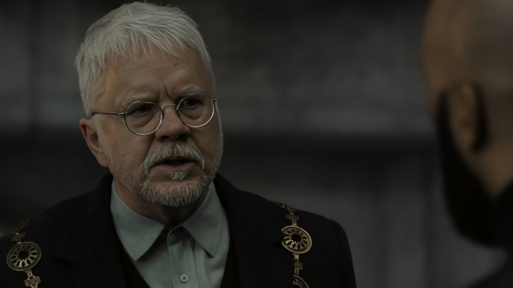 Tim Robbins as Bernard Holland and Common as Sims in Silo Season 2.