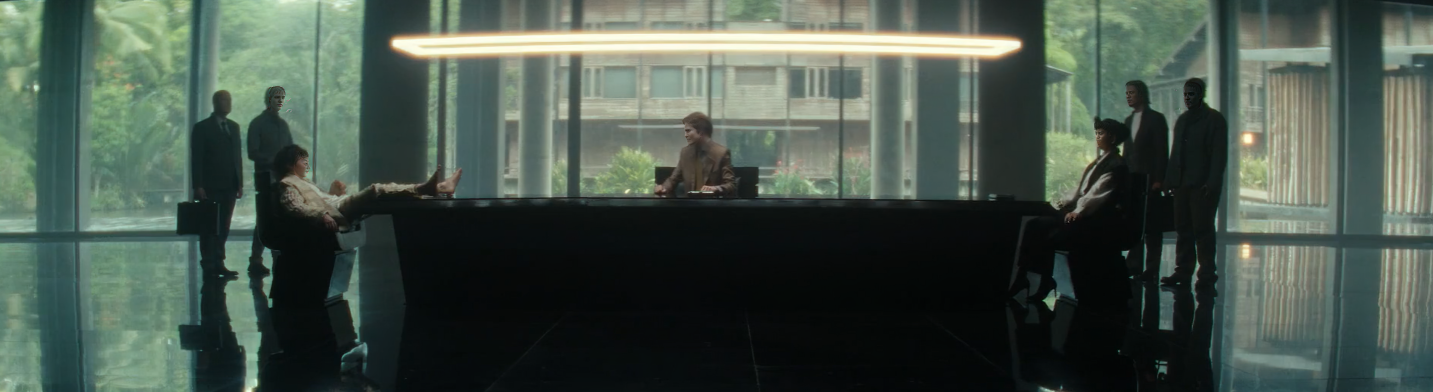 Boy Kavalier and Yutani face each other across a negotiation table.