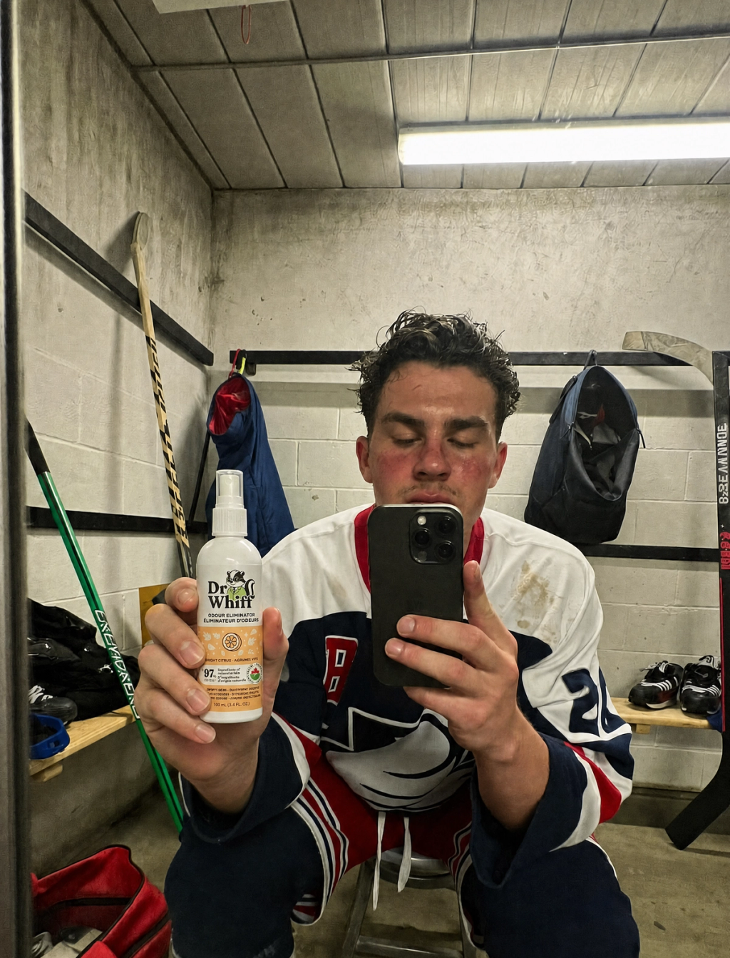 Dr. Whiff bottle on hockey gear in locker room 