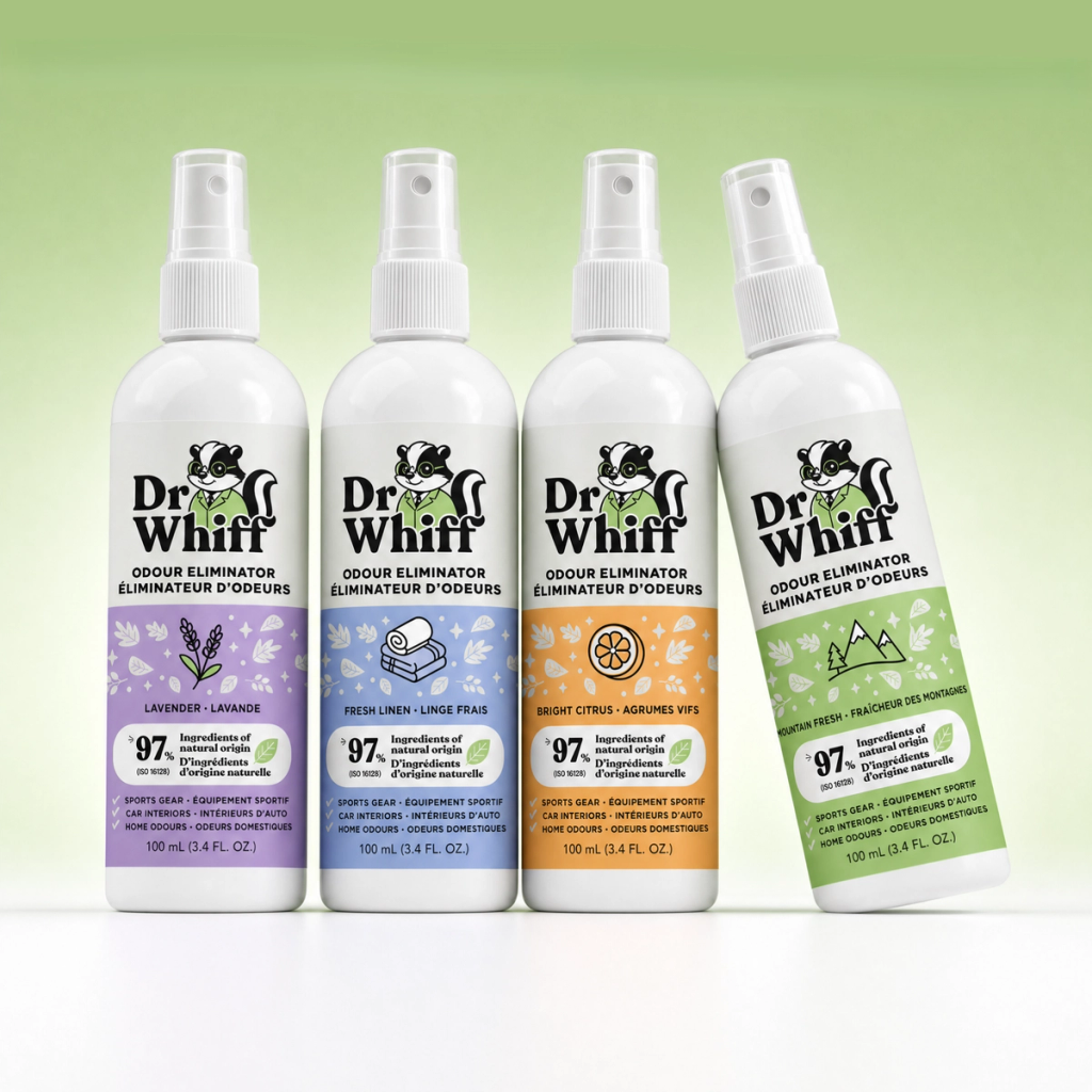Dr. Whiff odor eliminator sprays in four scents on a marble counter in a bright home setting