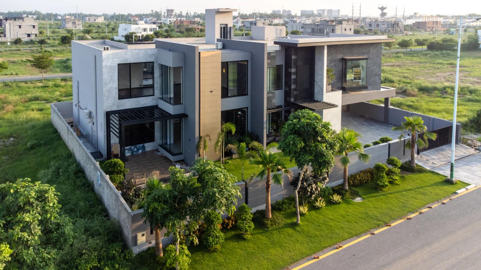 A boxy grey contemporary steel-and-glass villa.