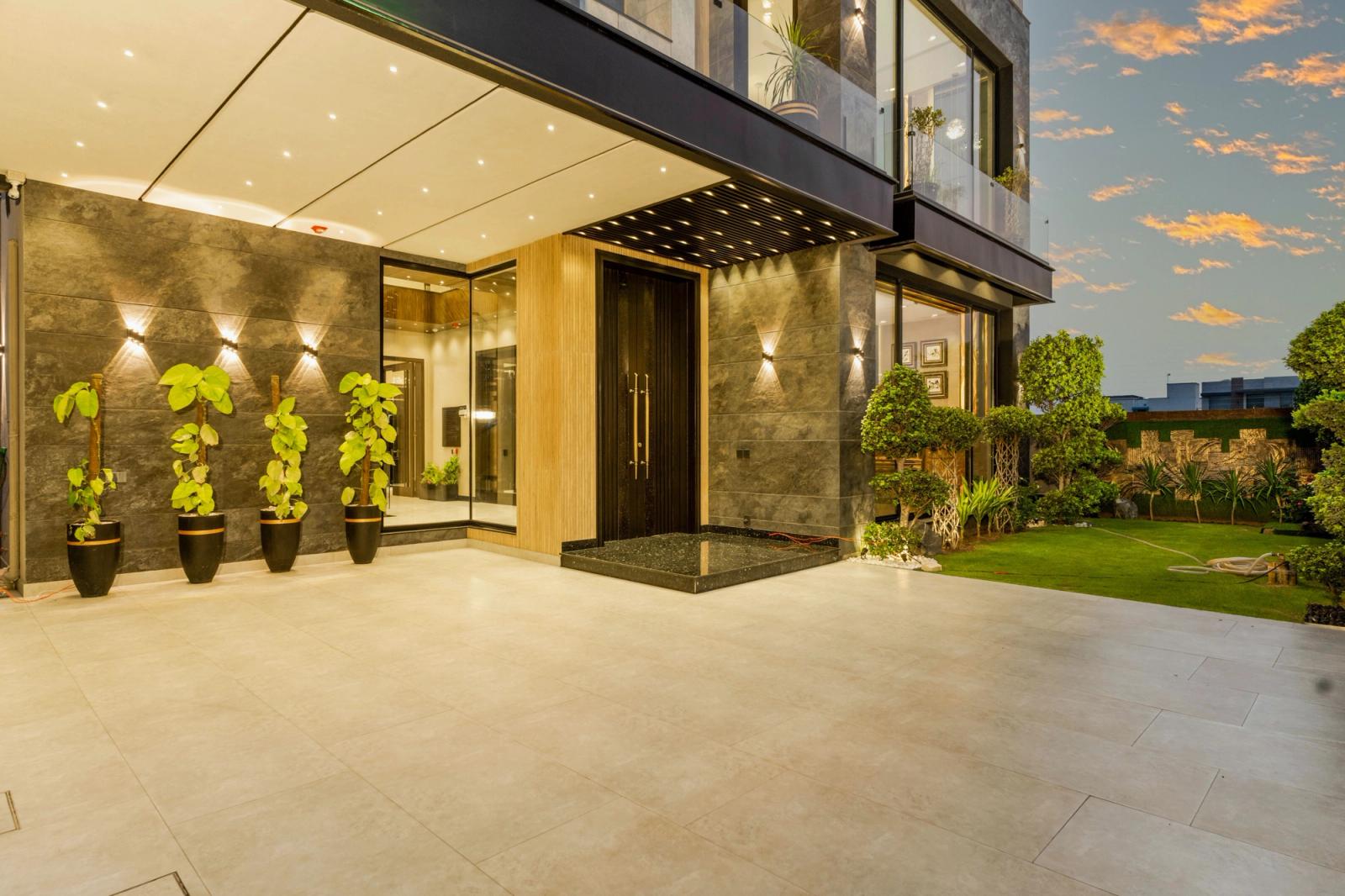 A stone-and-glass contemporary hillside villa.