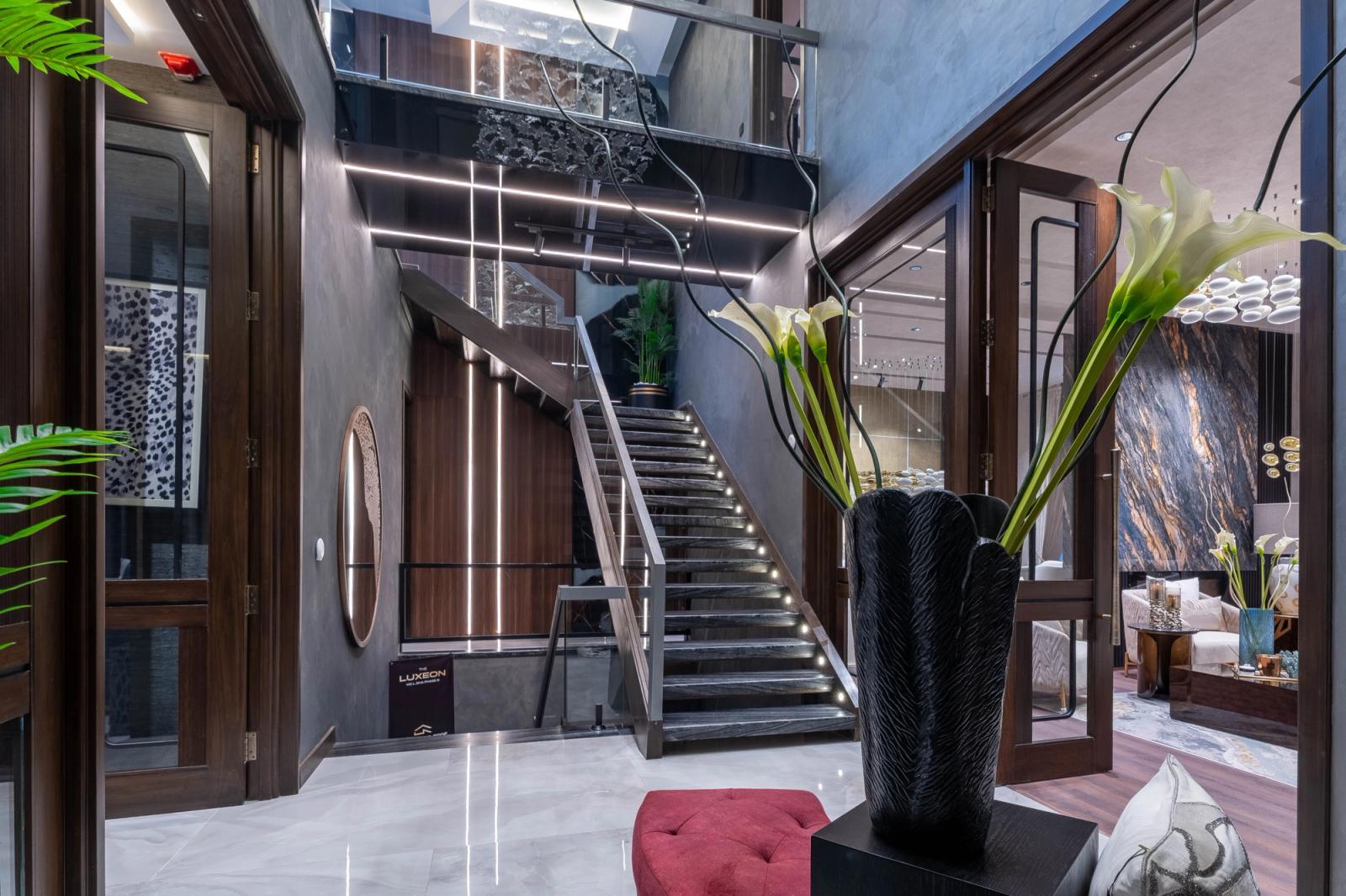 A dark marble-and-glass contemporary villa.
