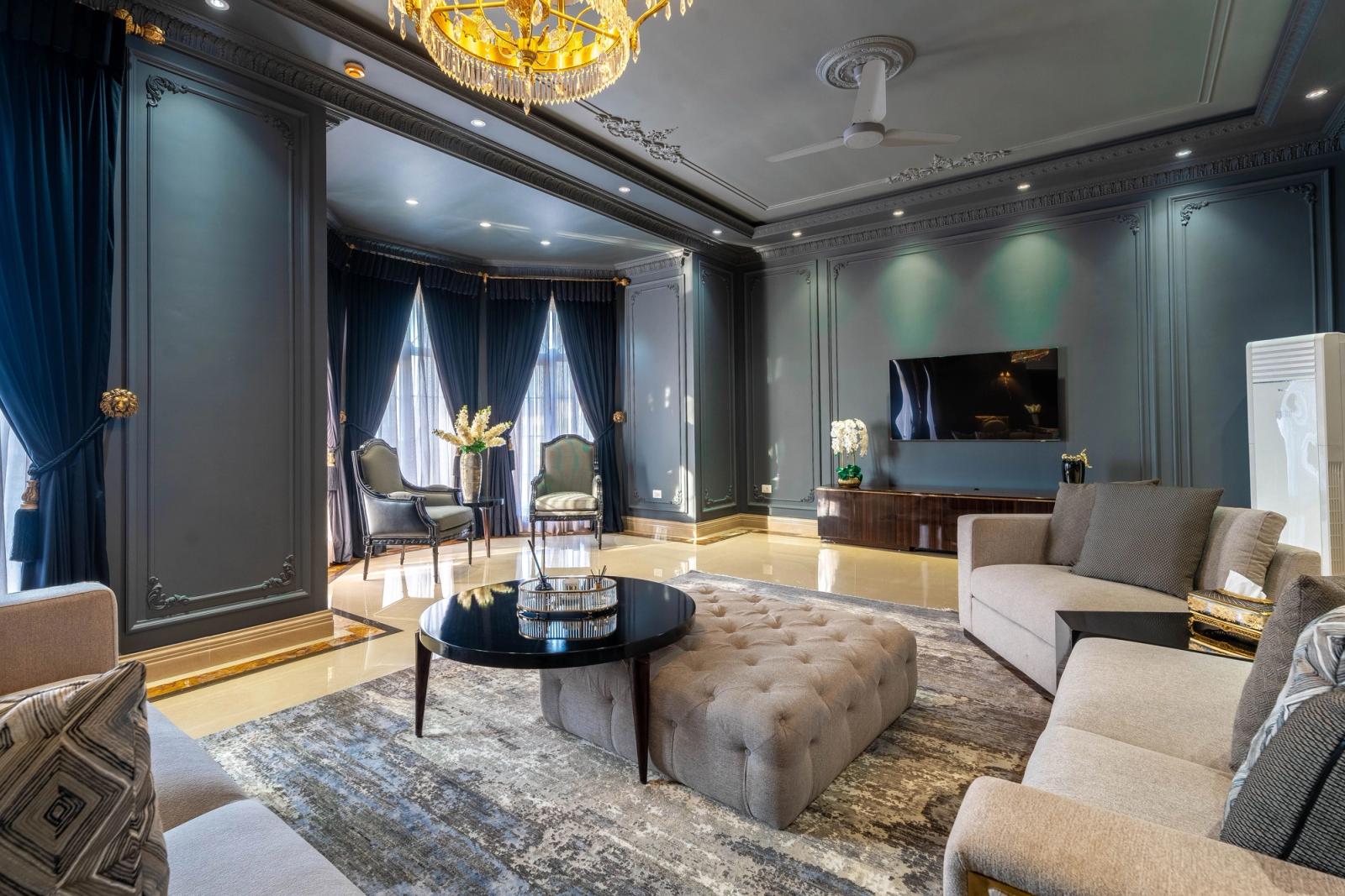 A palatial classical estate with grand, ornate interiors.