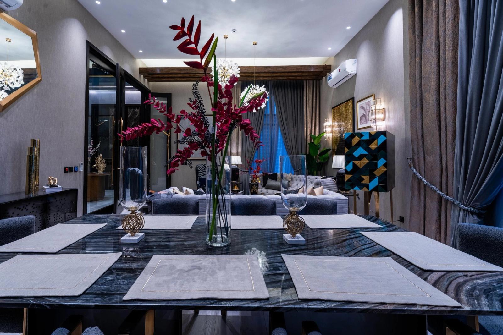 A charcoal-clad contemporary villa with tropical gardens.