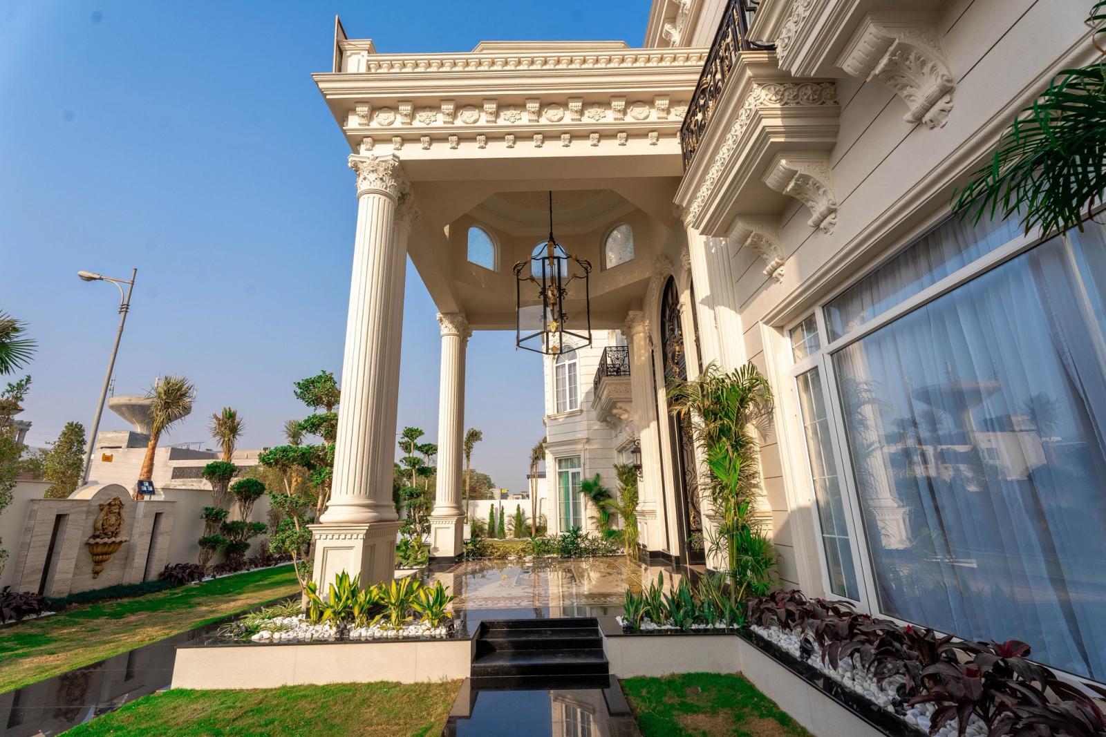 A palatial classical estate with grand, ornate interiors.